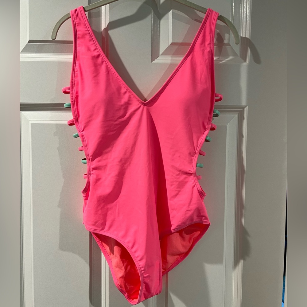 Pink One Piece strappy bathing suit. Never worn.